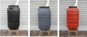 Colorado homeowner installing a 55-gallon rain barrel with a diverter kit