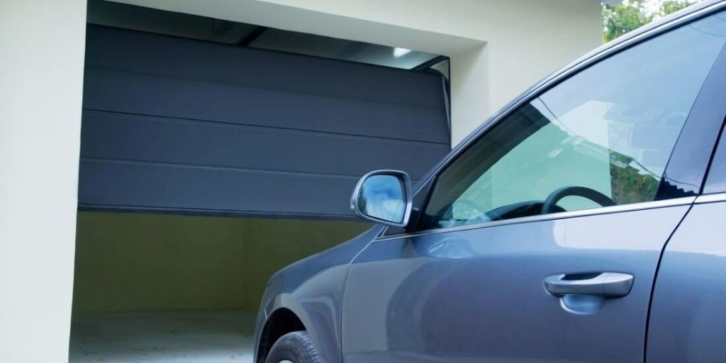 Side-by-side view of manual and automatic garage doors on British homes, highlighting convenience and functionality differences